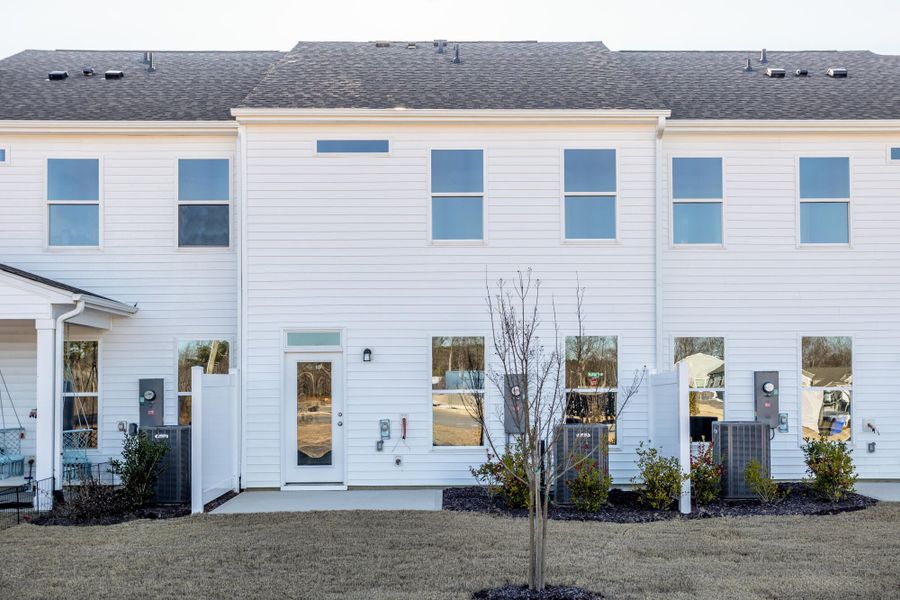 Exterior details and patio area of a home in 1158 Place Townhomes, Wilson (Image 3).