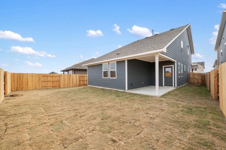 Exterior details and patio area of a home in Lariat, Liberty Hill (Image 25).