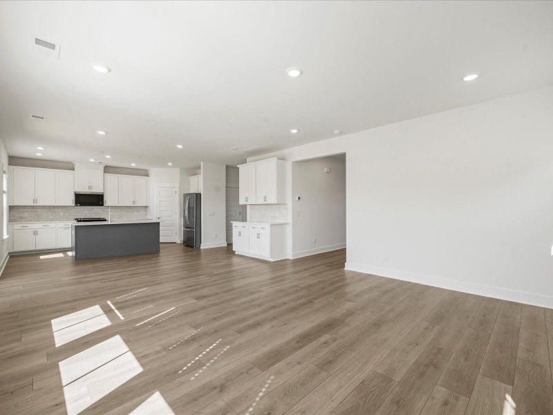 Spacious, unfurnished interior of a new home in The Coves at Lakes of Cane Bay II, Summerville (Image 24).