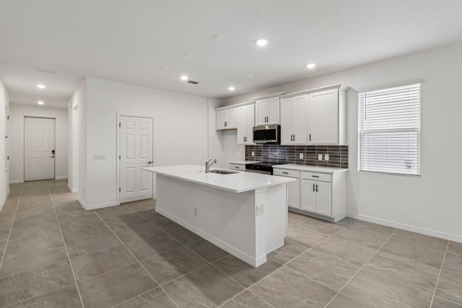 Furnished interior view inside a new home in Trinity Gardens, Deland (Image 4).