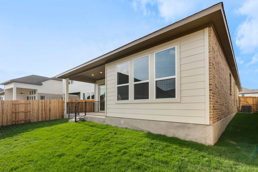 Exterior details and patio area of a home in Lariat, Liberty Hill (Image 24).