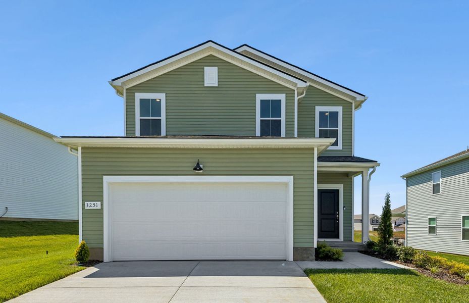 Front exterior of a new home in Highlands of Carter's Station, Columbia, TN, highlighting curb appeal (Image 2). Front exterior of a new home in Highlands of Carter's Station, Columbia, TN, highlighting curb appeal (Image 2).