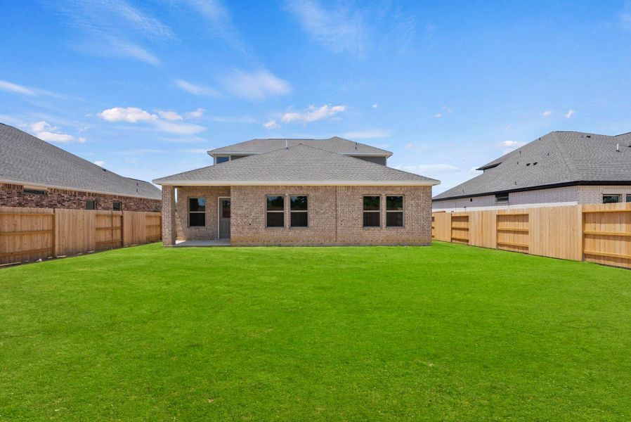 Exterior details and patio area of a home in Windcress, Cove (Image 4).