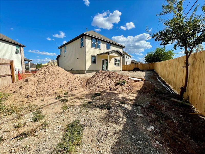 Front exterior of a new home in Covered Bridge, Hutto, TX, highlighting curb appeal (Image 20). Front exterior of a new home in Covered Bridge, Hutto, TX, highlighting curb appeal (Image 20).