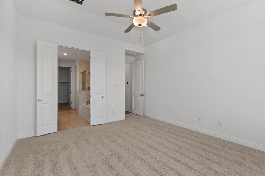 Primary Bedroom with elevated ceiling