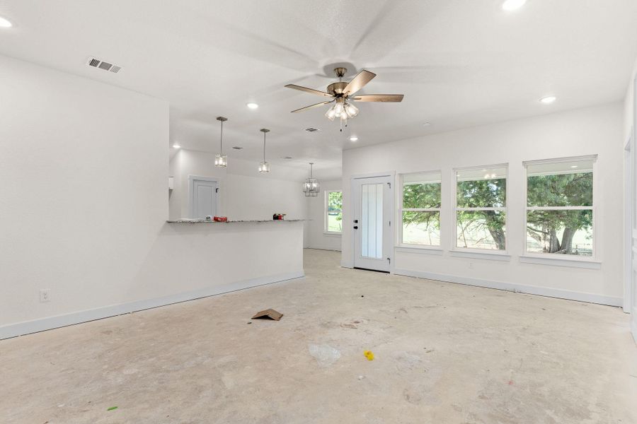 Unfurnished living room with recessed lighting and a ceiling fan Unfurnished living room with recessed lighting and a ceiling fan