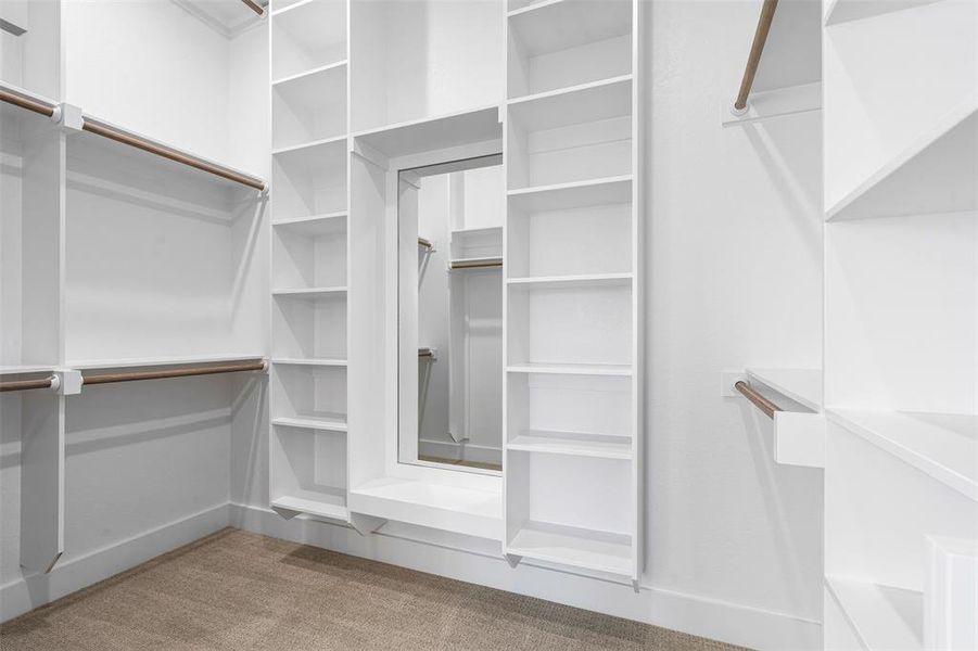 Spacious closet with carpet floors