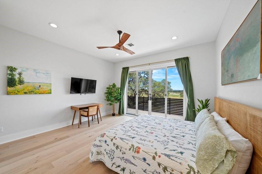 Wake up to sweeping views of Canyon Lake from this tranquil primary suite. Features private balcony, warm wood floors, and a minimalist design—this space is your perfect Hill Country retreat.