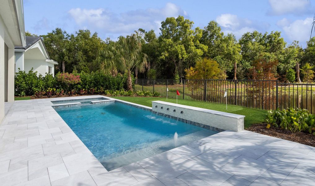 Scenic backyard with in-ground pool