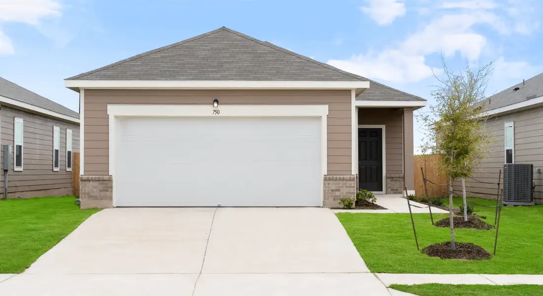 Front exterior of a new home in Hymeadow, Maxwell, TX, highlighting curb appeal (Image 1).