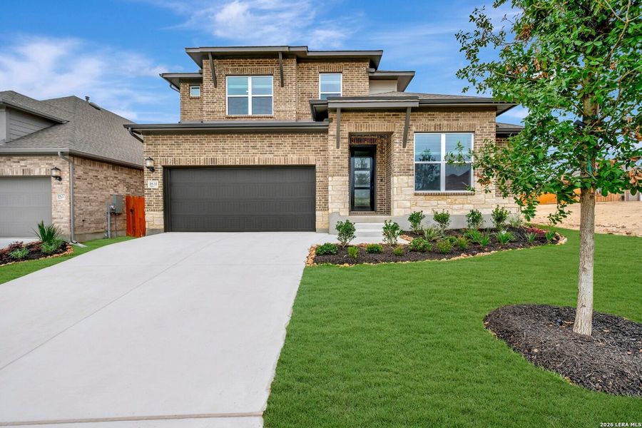 Front exterior of a new home in , New Braunfels, TX, highlighting curb appeal (Image 1). Front exterior of a new home in , New Braunfels, TX, highlighting curb appeal (Image 1).