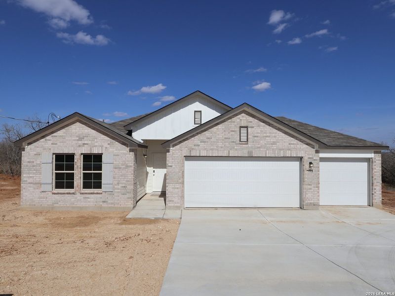 Front exterior of a new home in Chaparral Ranch, Floresville, TX, highlighting curb appeal (Image 21).