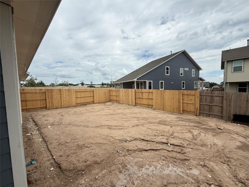 Front exterior of a new home in Cannon Ranch 45s, Dripping Springs, TX, highlighting curb appeal (Image 2). Front exterior of a new home in Cannon Ranch 45s, Dripping Springs, TX, highlighting curb appeal (Image 2).