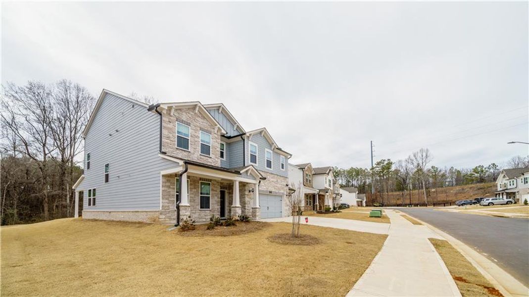 Front exterior of a new home in , Powder Springs, GA, highlighting curb appeal (Image 37). Front exterior of a new home in , Powder Springs, GA, highlighting curb appeal (Image 37).