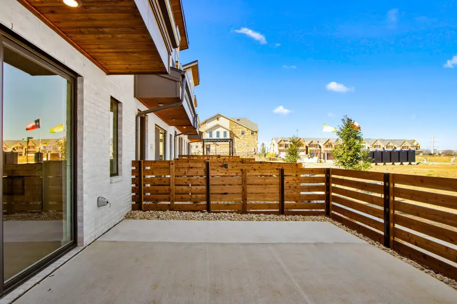 Exterior details and patio area of a home in Wildridge, Oak Point (Image 3).