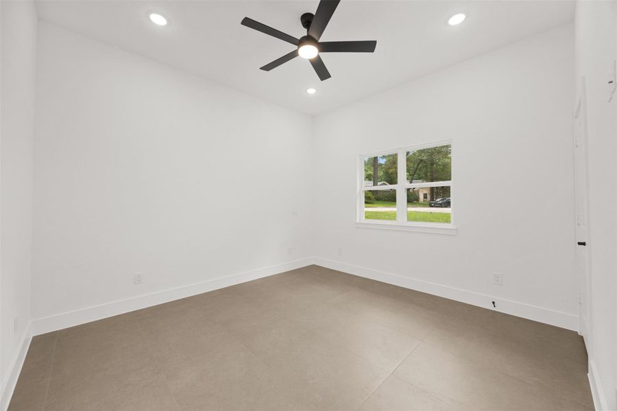 Second bedroom with tall ceilings, abundant natural light, and modern finishes.