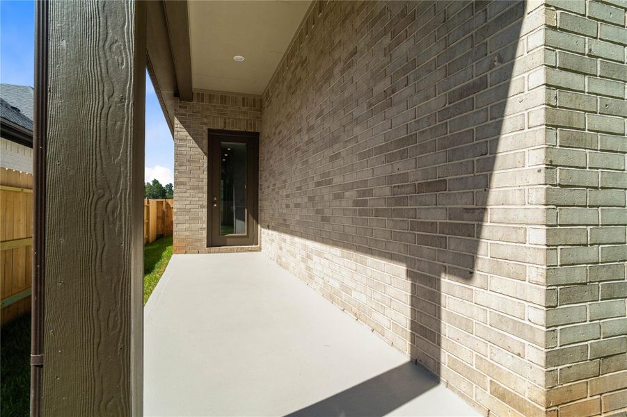 Covered patio overlooks a private, fully fenced backyard. Covered patio overlooks a private, fully fenced backyard.