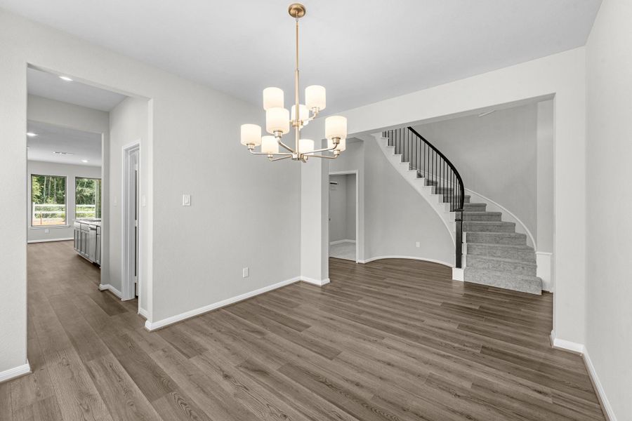 Winding staircase view from the formal dining room that is connected directly to the kitchen for entertaining.