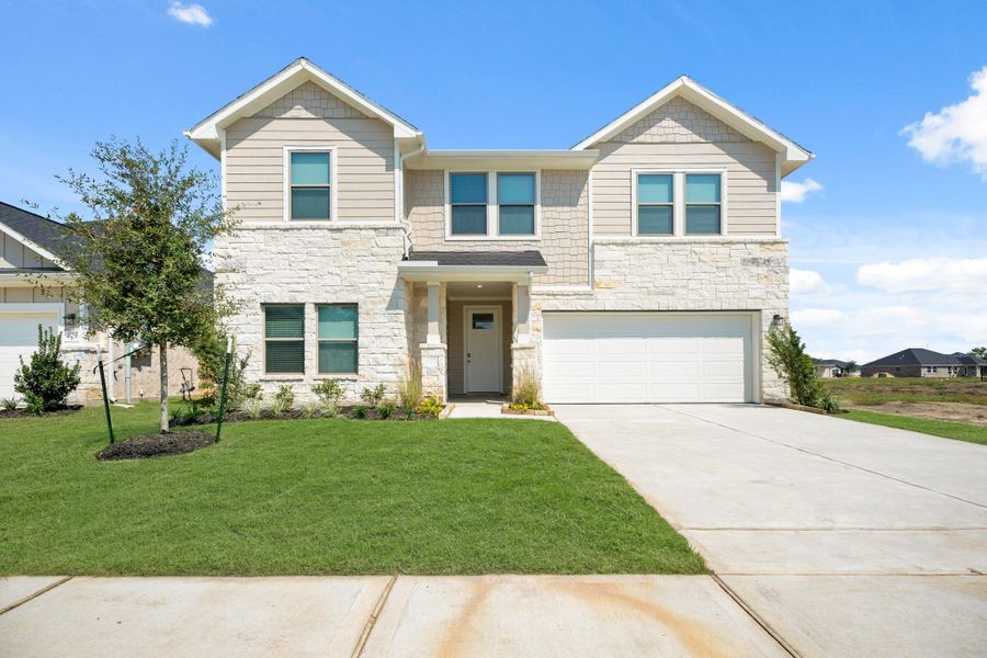 Front exterior of a new home in Laurel Landing, Alvin, TX, highlighting curb appeal (Image 15). Front exterior of a new home in Laurel Landing, Alvin, TX, highlighting curb appeal (Image 15).