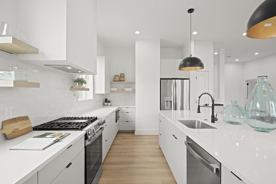 The stainless steel GE appliance package includes a gas range with 4 burners and a griddle, an oversized vent hood and dishwasher. The microwave is located in the lower cabinets and includes an air fryer with steaming capabilities. As an added bonus, the stainless steel refrigerator comes with the home ensuring the appliance package is complete! The stainless steel GE appliance package includes a gas range with 4 burners and a griddle, an oversized vent hood and dishwasher. The microwave is located in the lower cabinets and includes an air fryer with steaming capabilities. As an added bonus, the stainless steel refrigerator comes with the home ensuring the appliance package is complete!