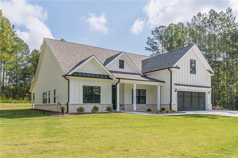 Front exterior of a new home in , Loganville, GA, highlighting curb appeal (Image 20).