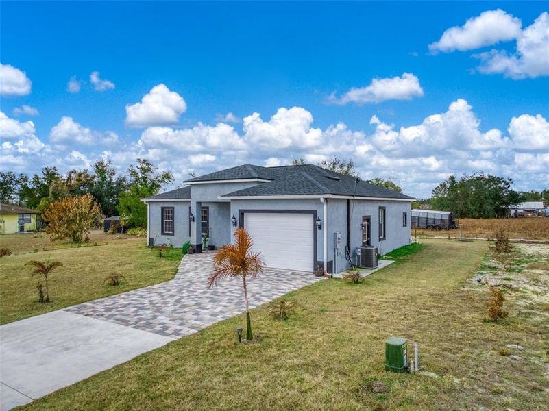 Front exterior of a new home in , Avon Park, FL, highlighting curb appeal (Image 27).