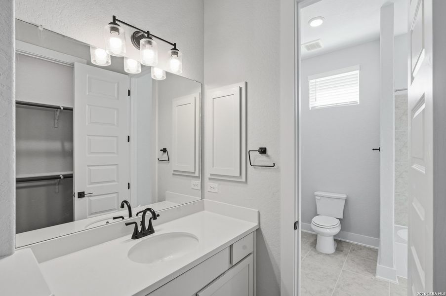 Furnished interior view inside a new home in Potranco Oaks, Castroville (Image 16).