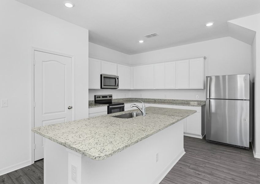 The kitchen is chef-ready with stainless steel appliances