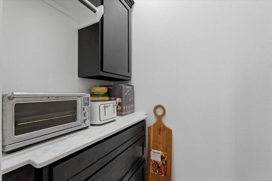 Butler's pantry off of kitchen that is perfect for extra appliances