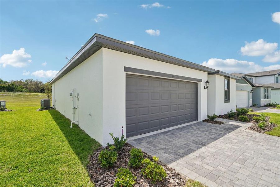 Exterior details and patio area of a home in The Reserve at Hammock Oaks - Signature Series, Lady Lake (Image 20).