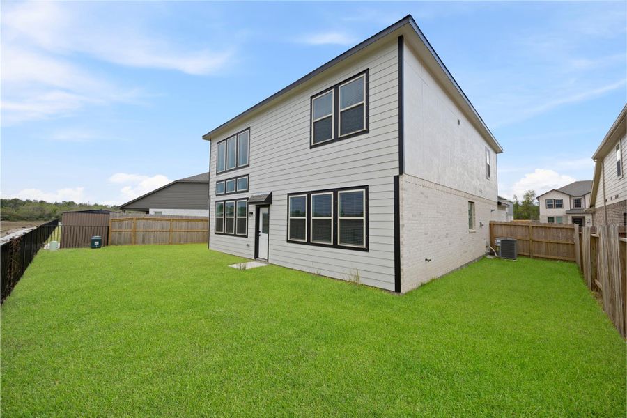 Exterior details and patio area of a home in Kendall Lakes, Alvin (Image 2). Exterior details and patio area of a home in Kendall Lakes, Alvin (Image 2).