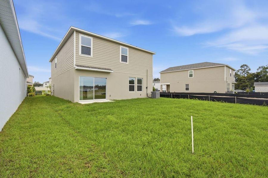 Exterior details and patio area of a home in Palm Wind, Hudson (Image 3).