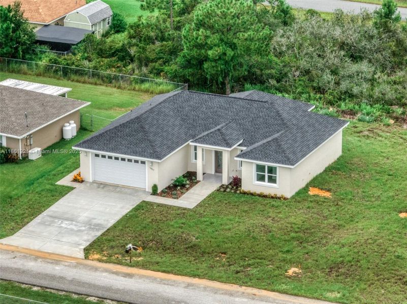 Front exterior of a new home in , Sebring, FL, highlighting curb appeal (Image 24).