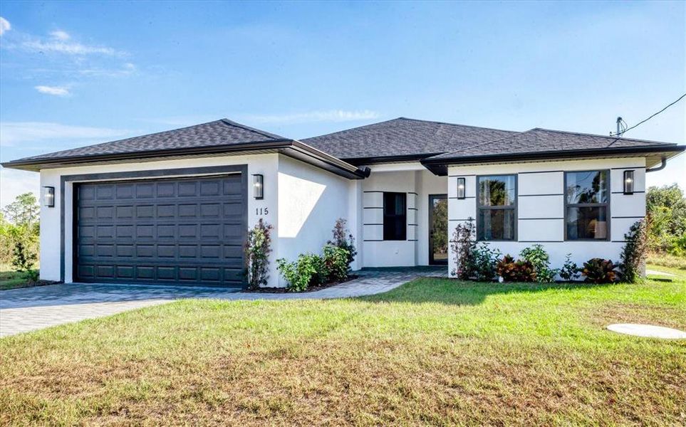 Front exterior of a new home in , Rotonda West, FL, highlighting curb appeal (Image 23). Front exterior of a new home in , Rotonda West, FL, highlighting curb appeal (Image 23).