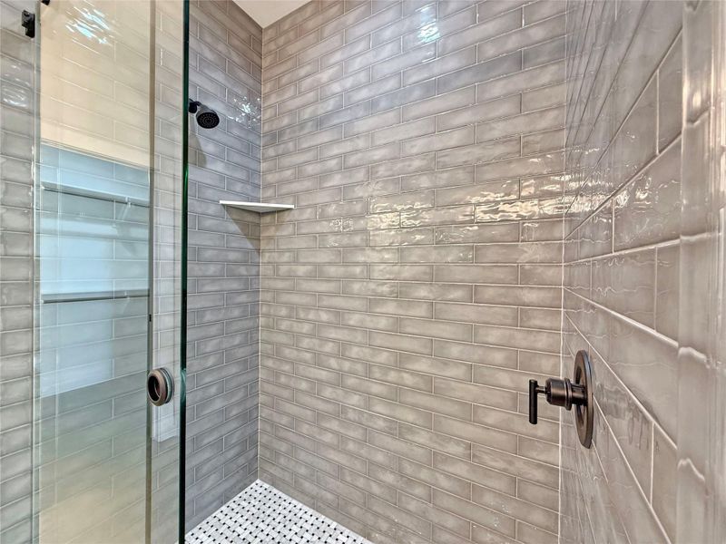 Primary Bathroom featuring a shower stall with beautiful Ceramic Tile