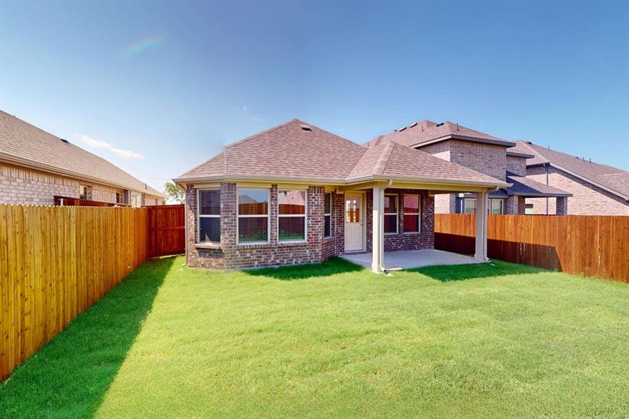 Front exterior of a new home in Elevon, Lavon, TX, highlighting curb appeal (Image 1).