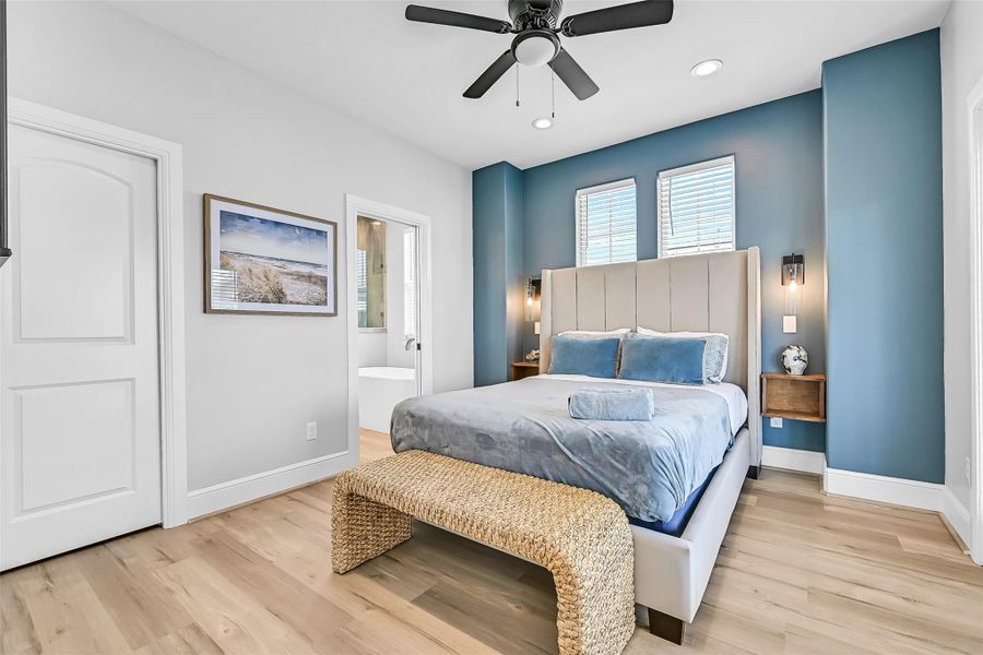 This upstairs primary bedroom (one of two upstairs primary bedrooms) combines comfort and functionality with enough room to truly spread out. The natural light keeps the space feeling warm and inviting throughout the day.  Theres a door out to the deck to enjoy the amazing views of the ocean!