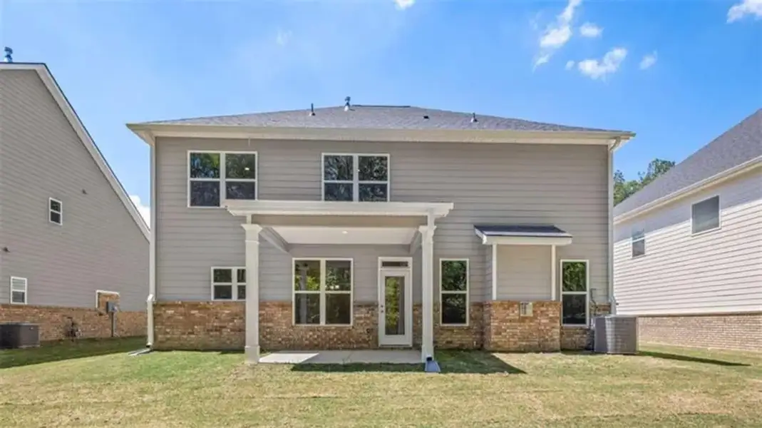 Exterior details and patio area of a home in Wildwood, Covington (Image 2). Exterior details and patio area of a home in Wildwood, Covington (Image 2).
