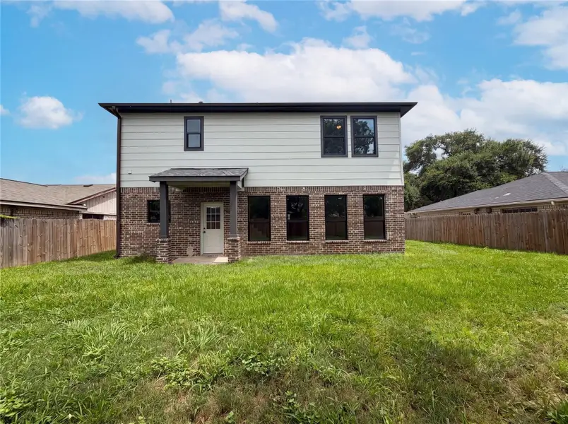 Exterior details and patio area of a home in , Houston (Image 2). Exterior details and patio area of a home in , Houston (Image 2).