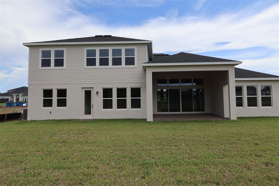 Exterior details and patio area of a home in Solace at Corner Lake, Orlando (Image 20). Exterior details and patio area of a home in Solace at Corner Lake, Orlando (Image 20).