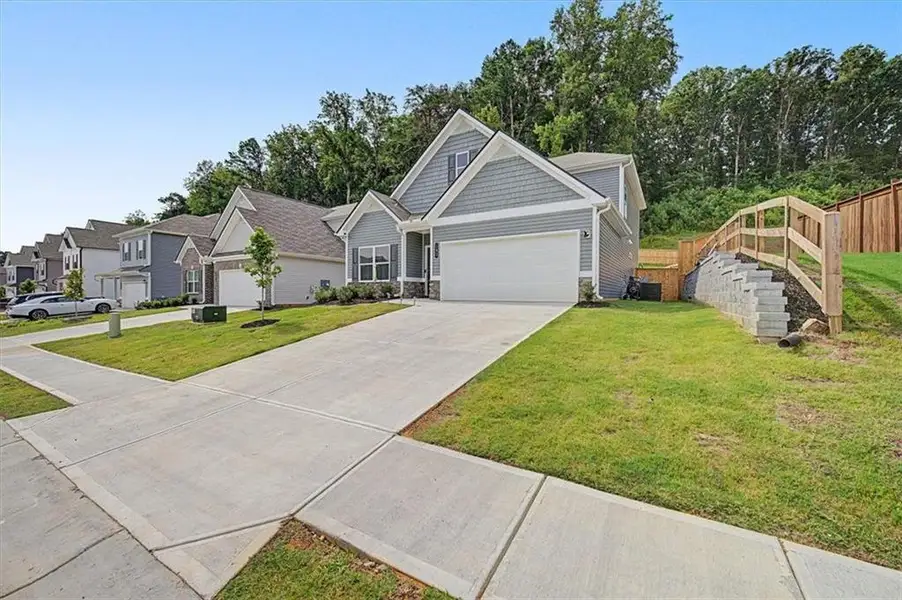 Front exterior of a new home in , Calhoun, GA, highlighting curb appeal (Image 1). Front exterior of a new home in , Calhoun, GA, highlighting curb appeal (Image 1).