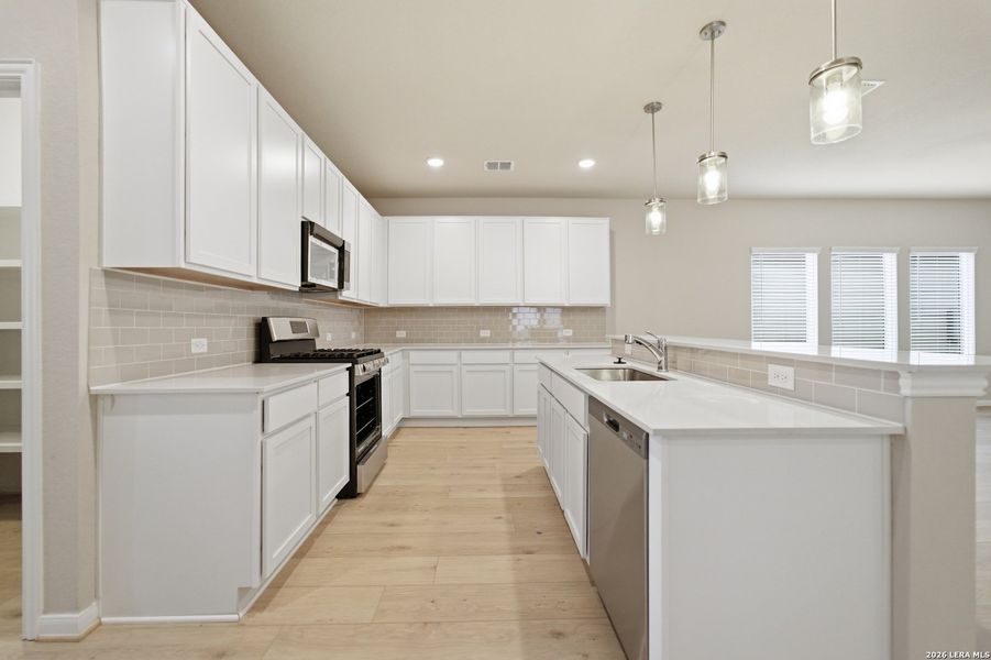 Furnished interior view inside a new home in Hennersby Hollow, San Antonio (Image 9).