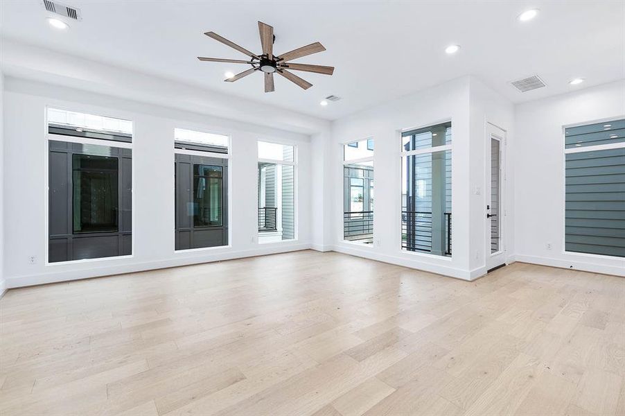 Large living area with tons of natural lighting. You have an oudoor balcony space as well. Beautfiul engineered wood floors.