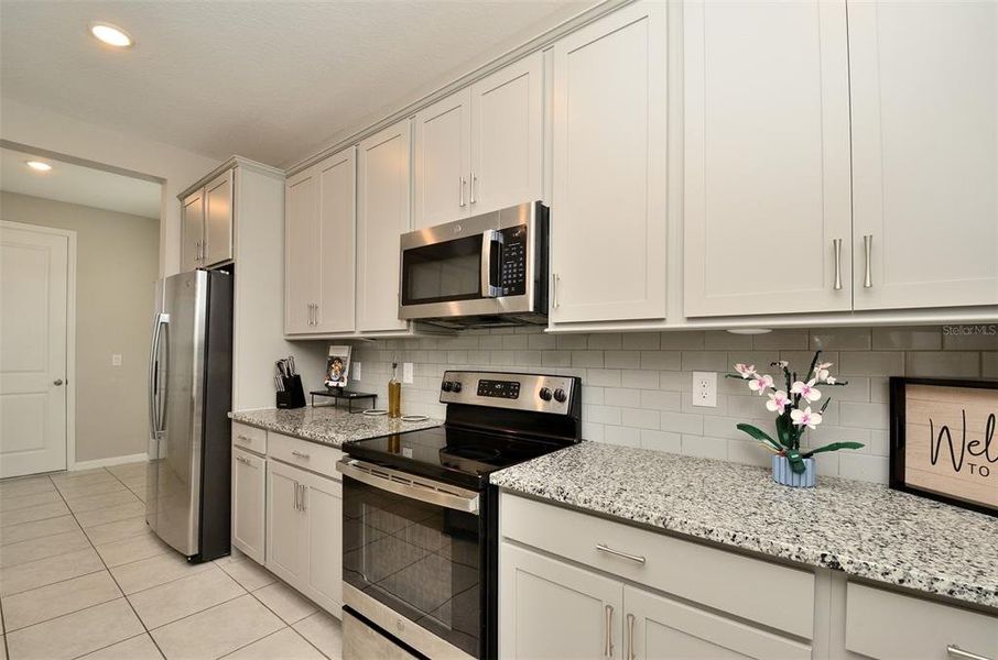 Furnished interior view inside a new home in Seasons at Eden Hills, Lake Alfred (Image 14).