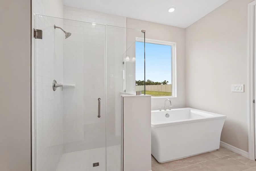 The primary bathroom has a large walk-in shower