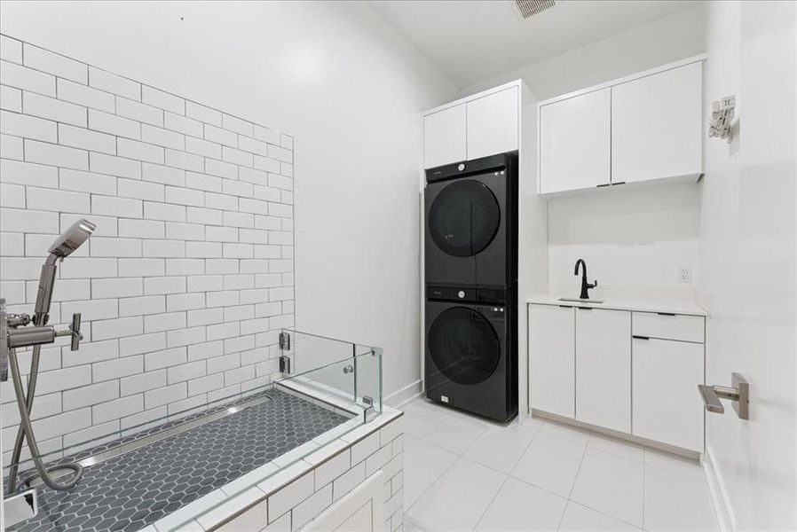 Laundry area with stackable washer dryer connections and doggie bath