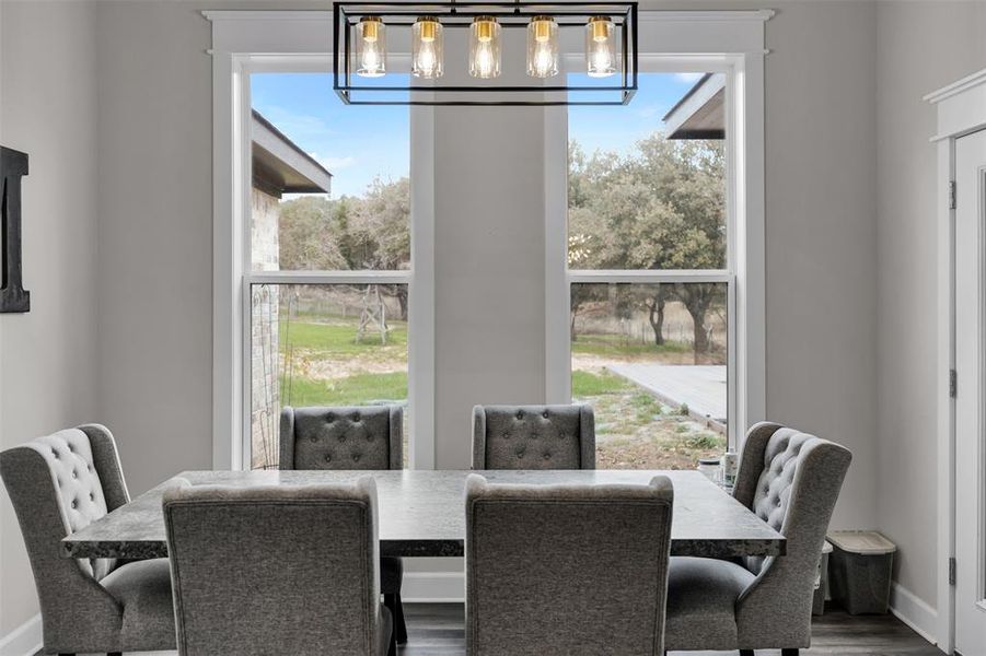 Dining space with wood-type flooring