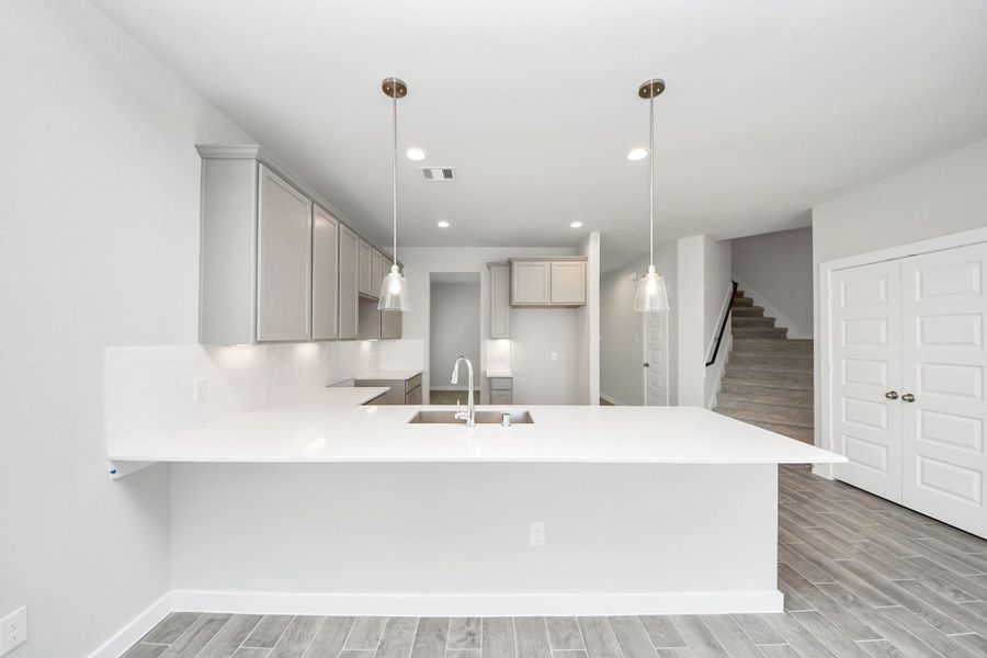 This generously spacious kitchen is a dream realized! Sample photo of completed home with similar floor plan. Actual colors and selections may vary. This generously spacious kitchen is a dream realized! Sample photo of completed home with similar floor plan. Actual colors and selections may vary.