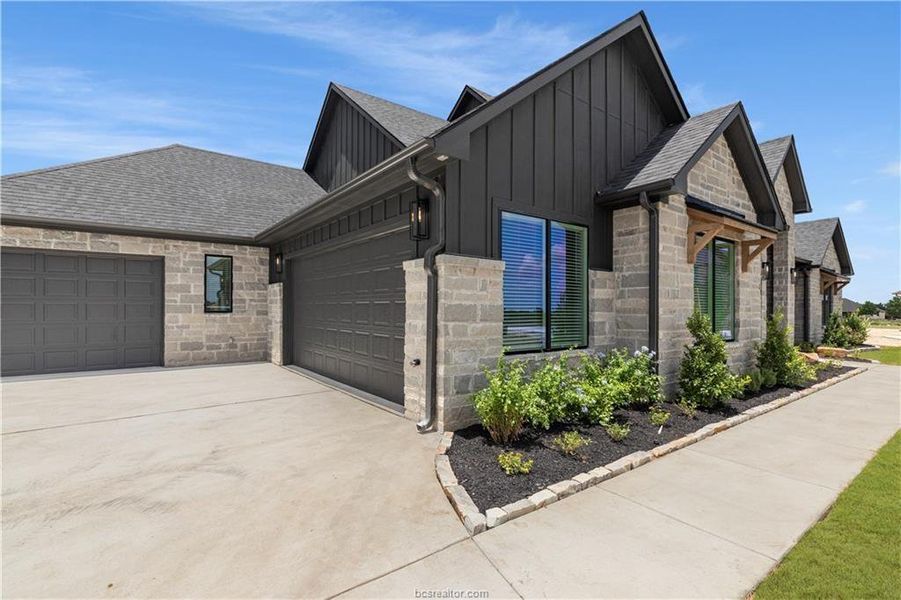 Front exterior of a new home in , Bryan, TX, highlighting curb appeal (Image 22).
