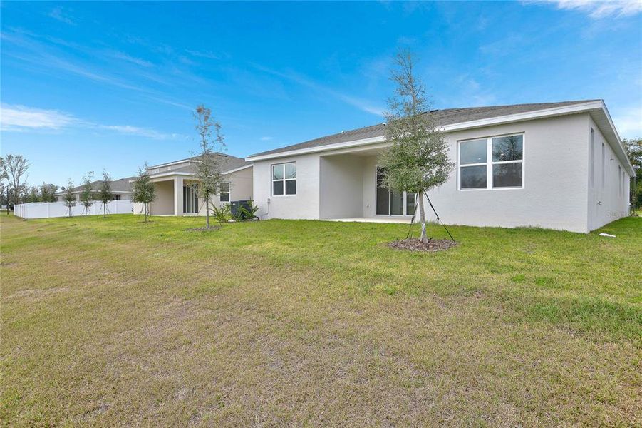 Exterior details and patio area of a home in Seasons at Grandview Gardens, Deland (Image 16).